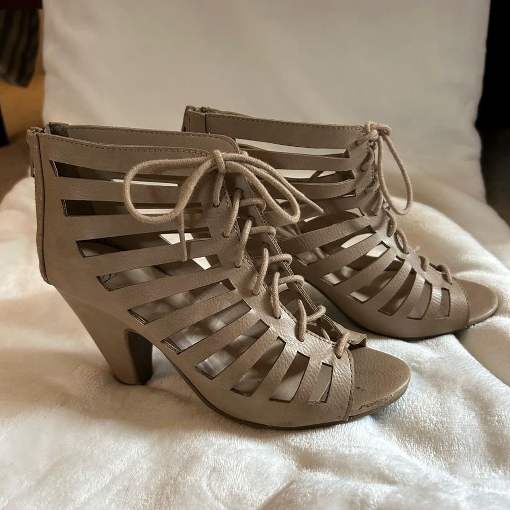 In good condition. Beige, cutout bootie heels. From Forever 21. Women’s size 7.